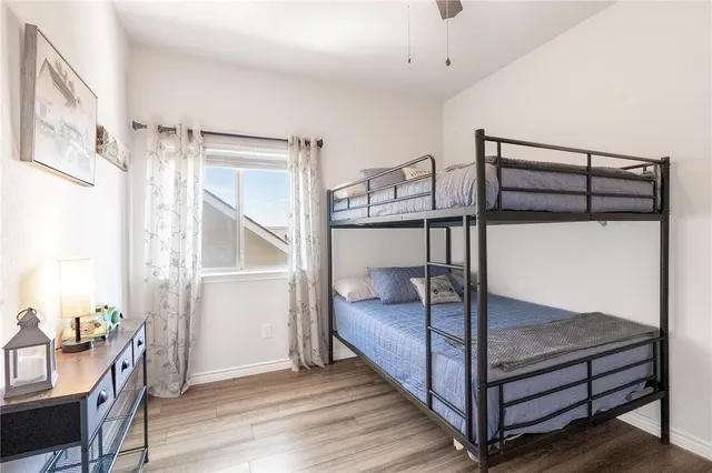 a bedroom with a bunk bed and a desk in it