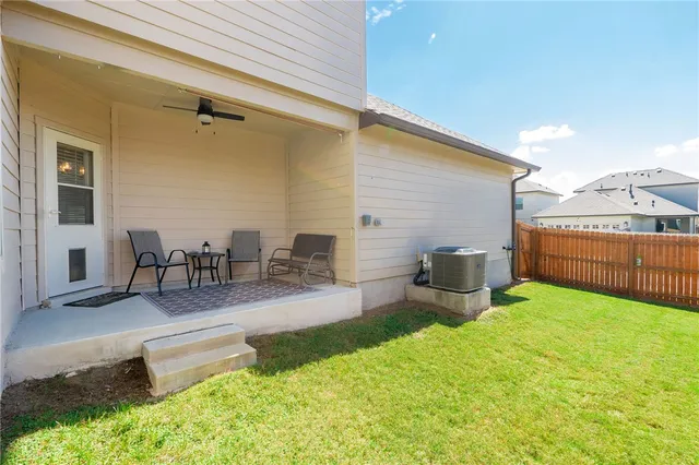 a balcony with furniture and a yard