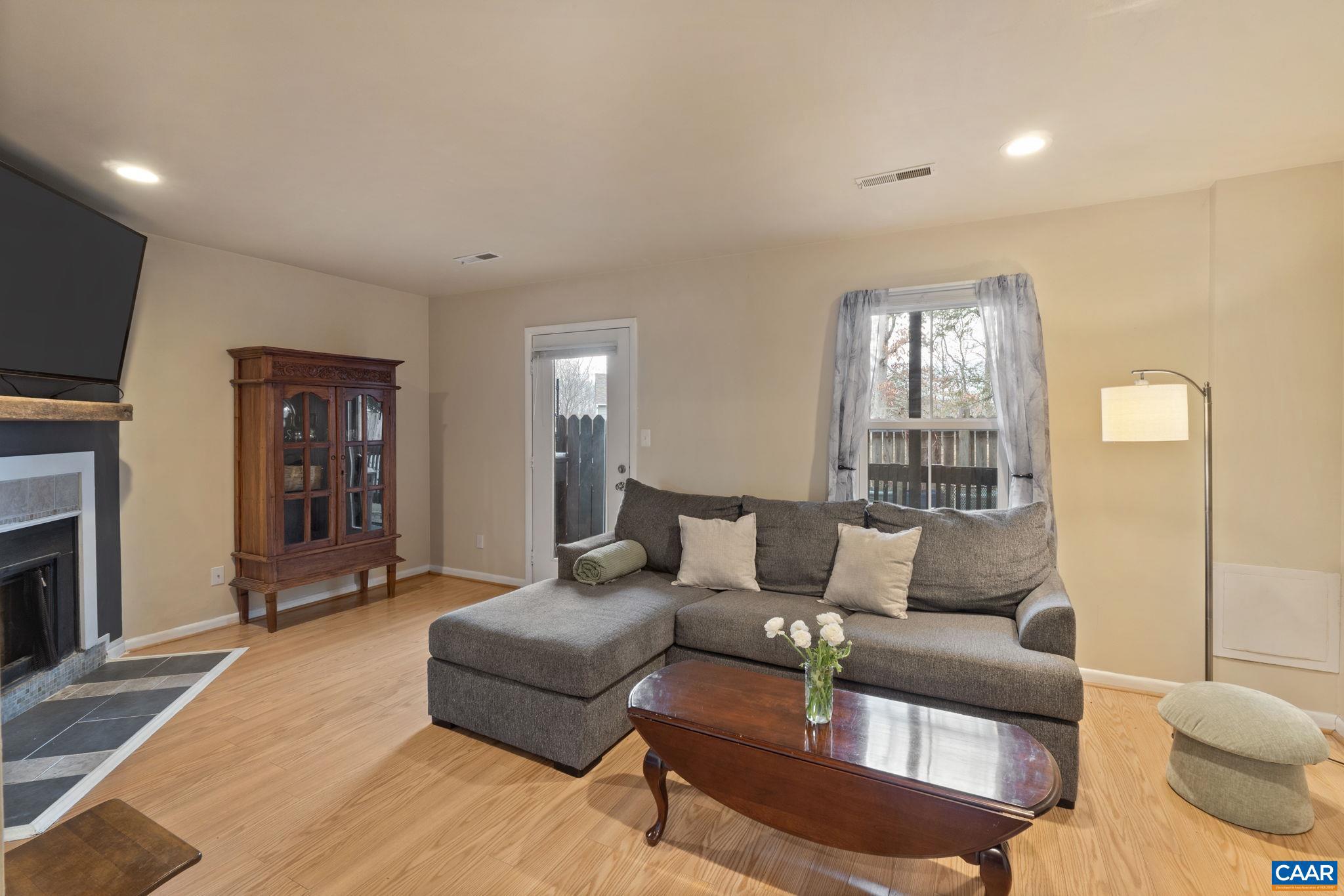 782 Merion Greene Charlottesville, VA 22901 - Photo 12 of 32 a living room with furniture and a flat screen tv