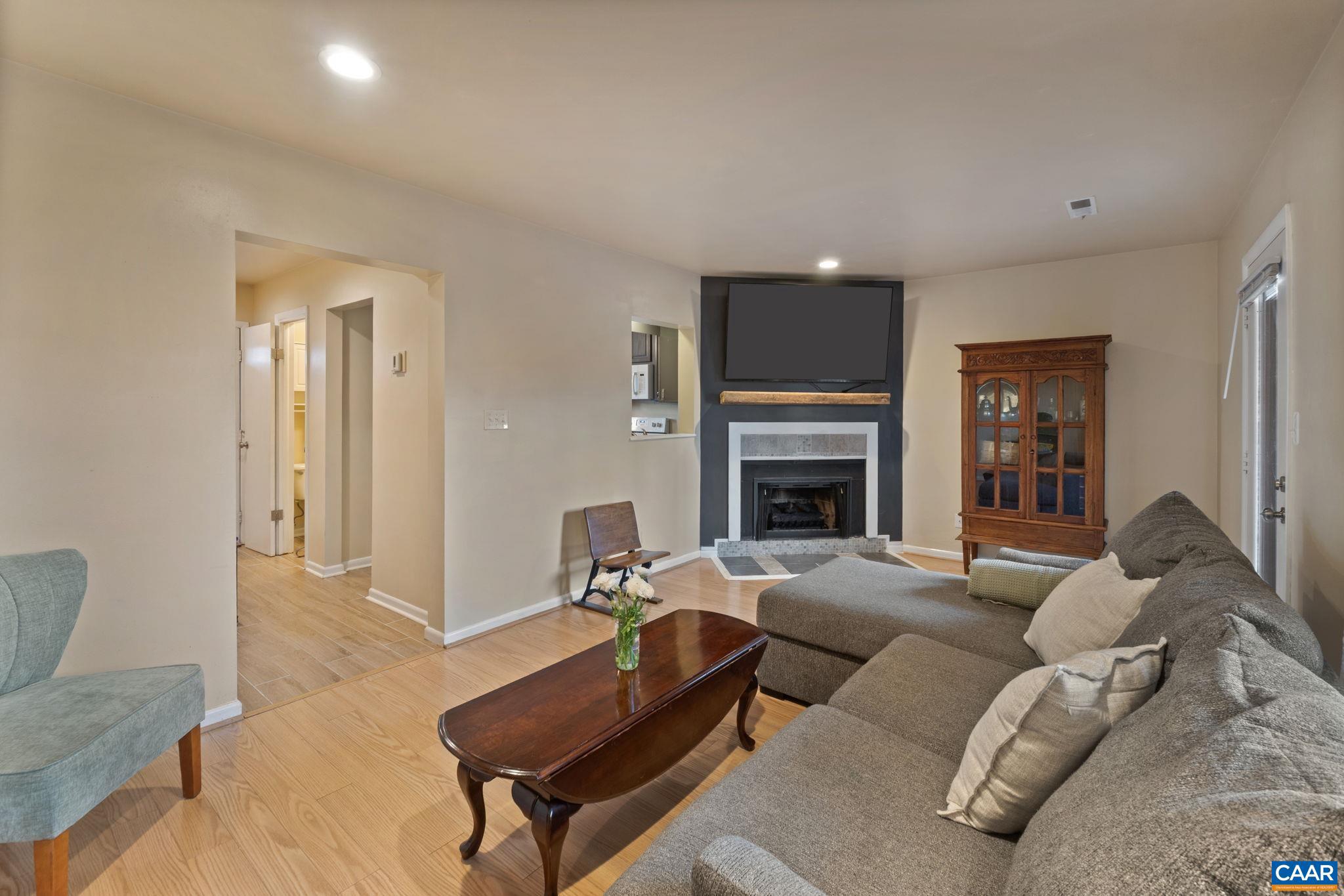 782 Merion Greene Charlottesville, VA 22901 - Photo 14 of 32 a living room with furniture and a fireplace