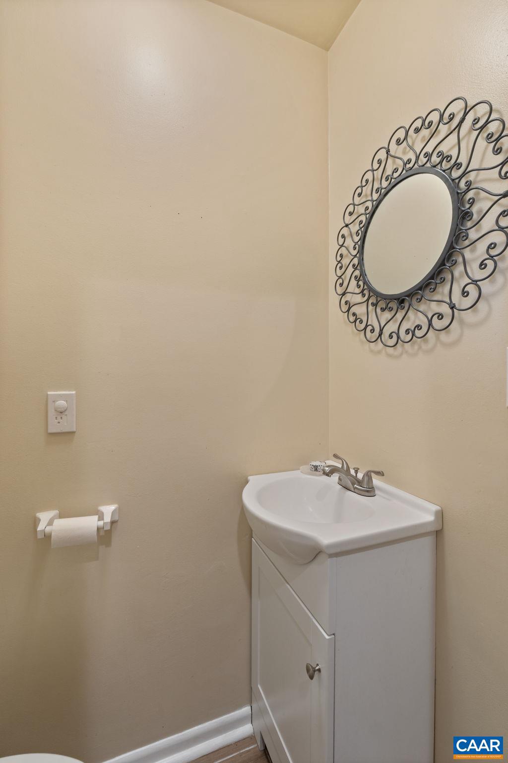 782 Merion Greene Charlottesville, VA 22901 - Photo 7 of 32 a bathroom with a sink and a mirror