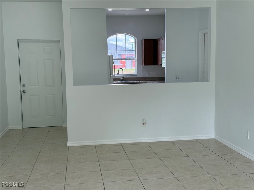 3969 Sunset Road Lehigh Acres, FL 33971 - Photo 12 of 29 a view of empty room with window