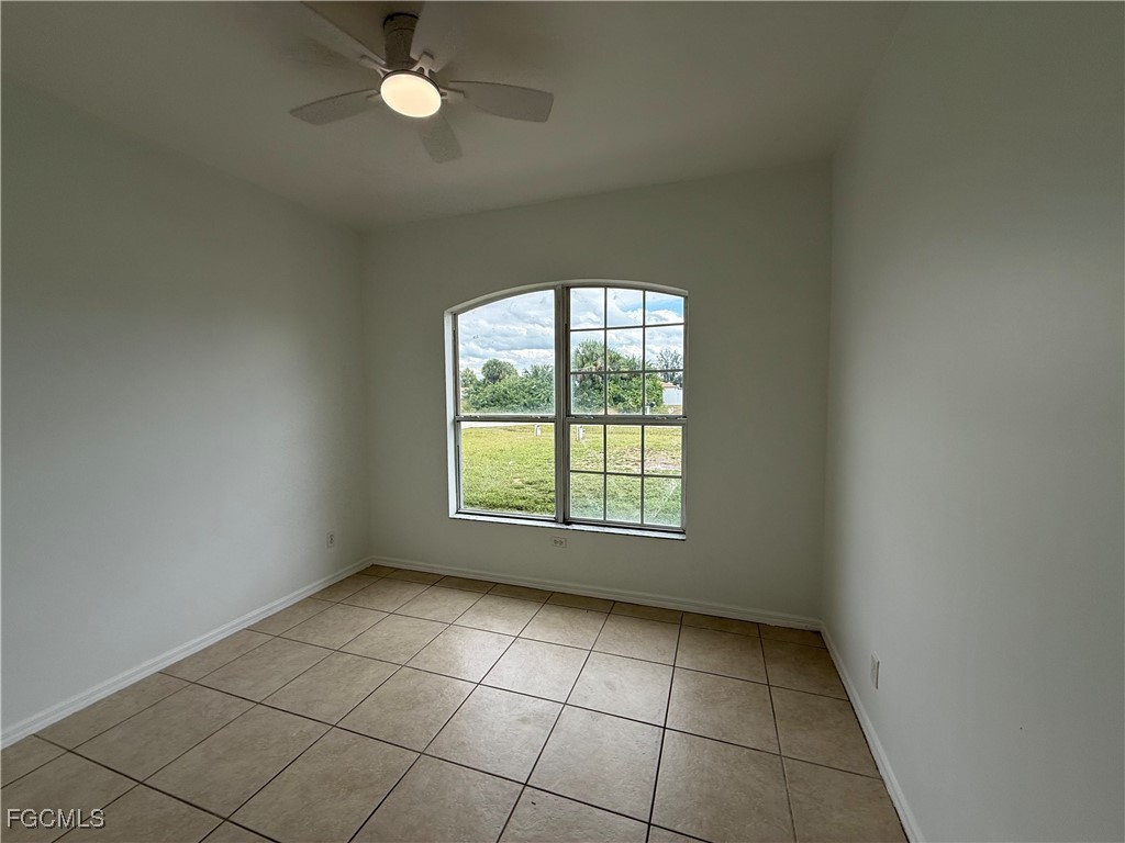 3969 Sunset Road Lehigh Acres, FL 33971 - Photo 21 of 29 a view of an empty room with a window