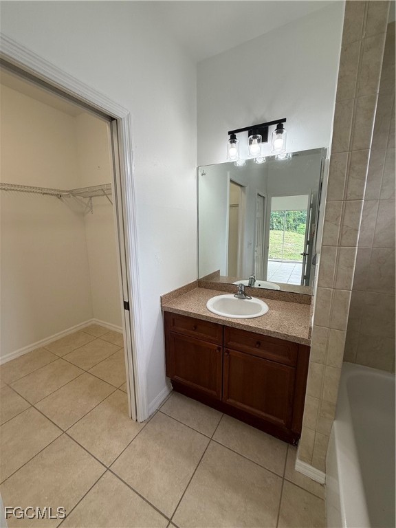 3969 Sunset Road Lehigh Acres, FL 33971 - Photo 24 of 29 a bathroom with a granite countertop sink and a mirror