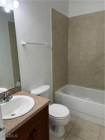 a bathroom with a sink a toilet and a bathtub
