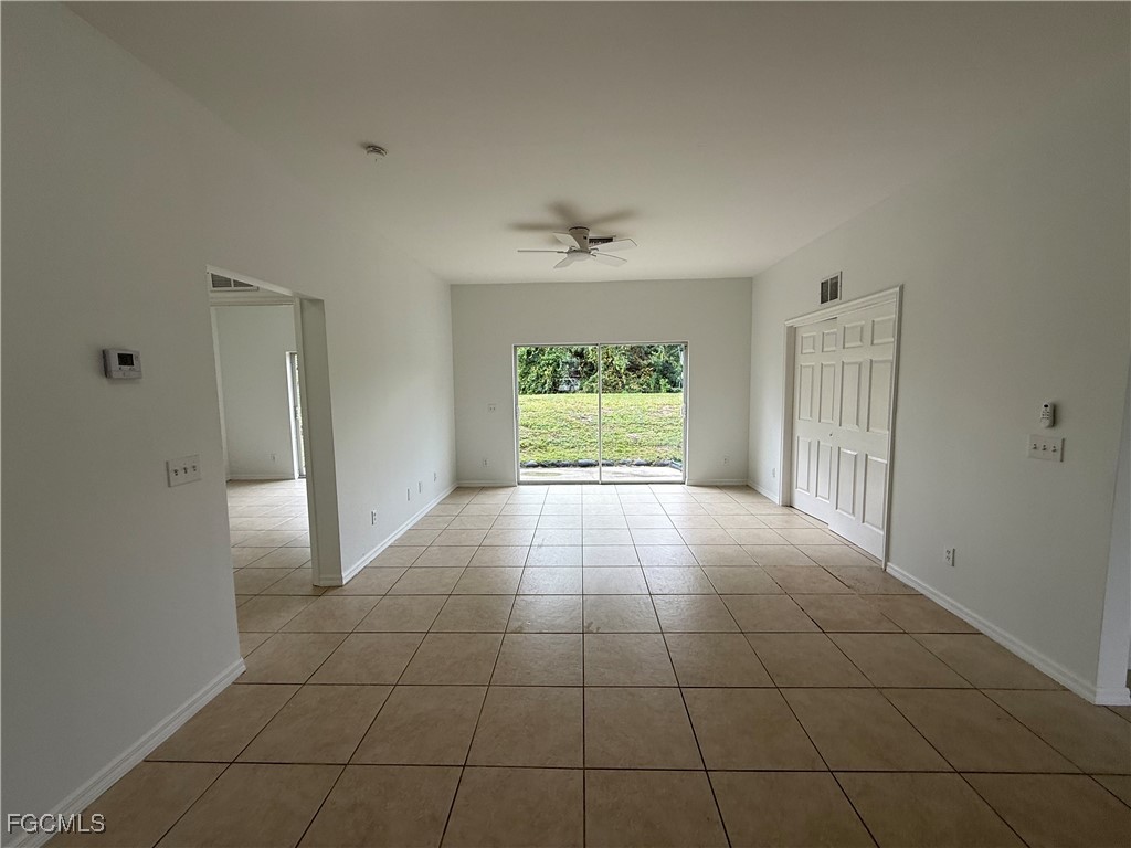 3969 Sunset Road Lehigh Acres, FL 33971 - Photo 3 of 29 a view of an empty room with a window