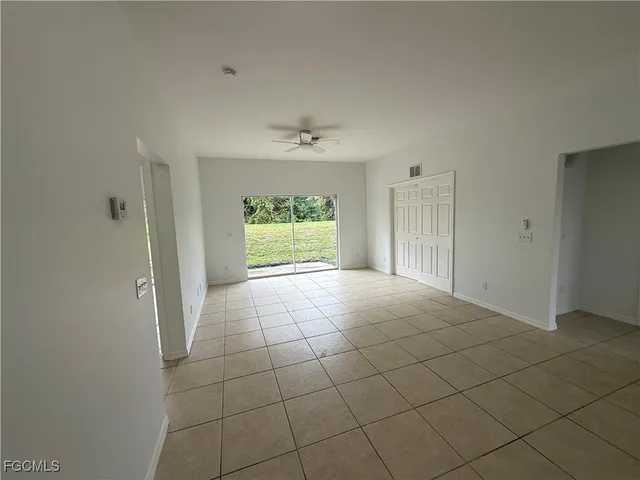 an empty room with a empty space and a window