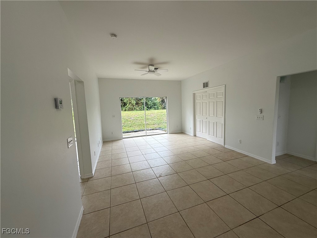 3969 Sunset Road Lehigh Acres, FL 33971 - Photo 4 of 29 an empty room with a empty space and a window