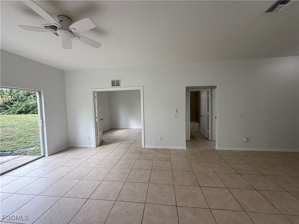 3969 Sunset Road Lehigh Acres, FL 33971 - Photo 5 of 29 a view of an empty room with a window