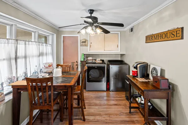 a view of a livingroom with furniture and a dining table