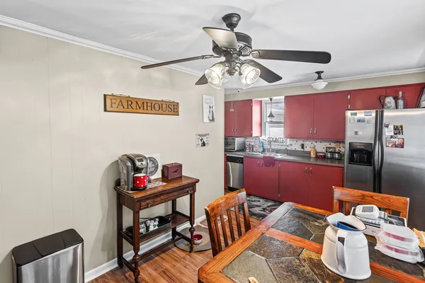 a kitchen with stainless steel appliances granite countertop a refrigerator and a stove