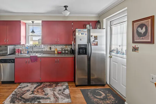 a kitchen with stainless steel appliances granite countertop a stove and a refrigerator