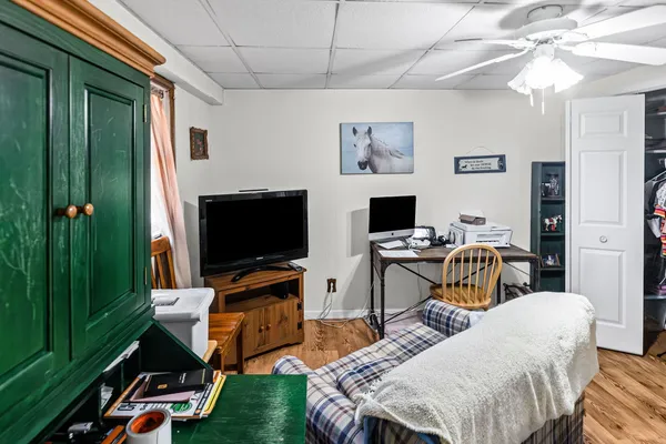 a bedroom with a bed and a tv