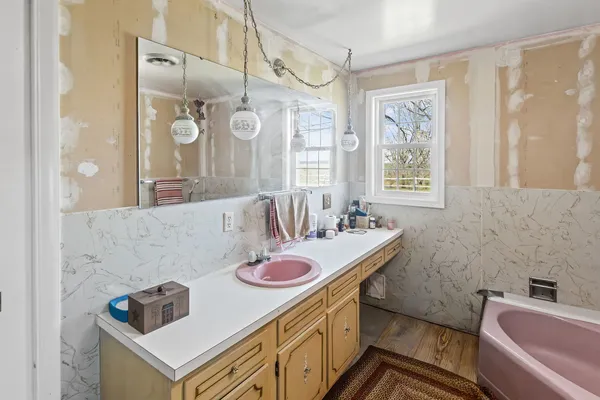 a room with furniture gym equipment and a flat screen tv