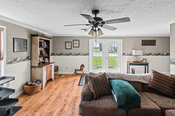 an aerial view of a house with a yard
