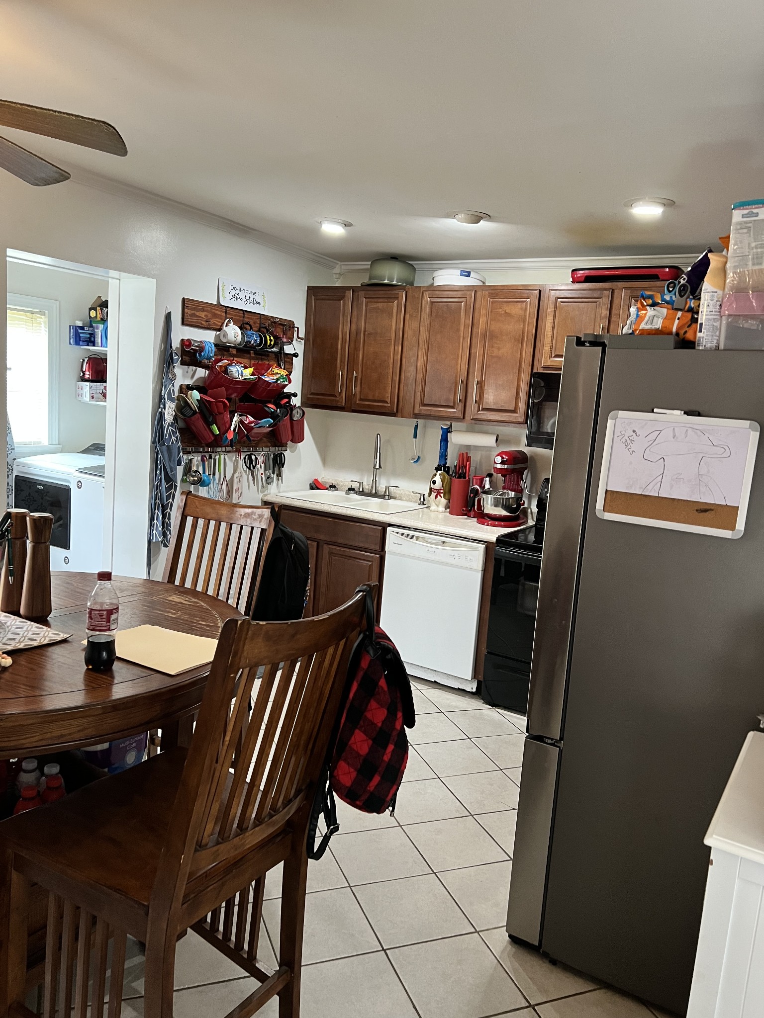 431 Elm Street Baxter, TN 38544 - Photo 15 of 22 a kitchen with a sink a stove and chairs