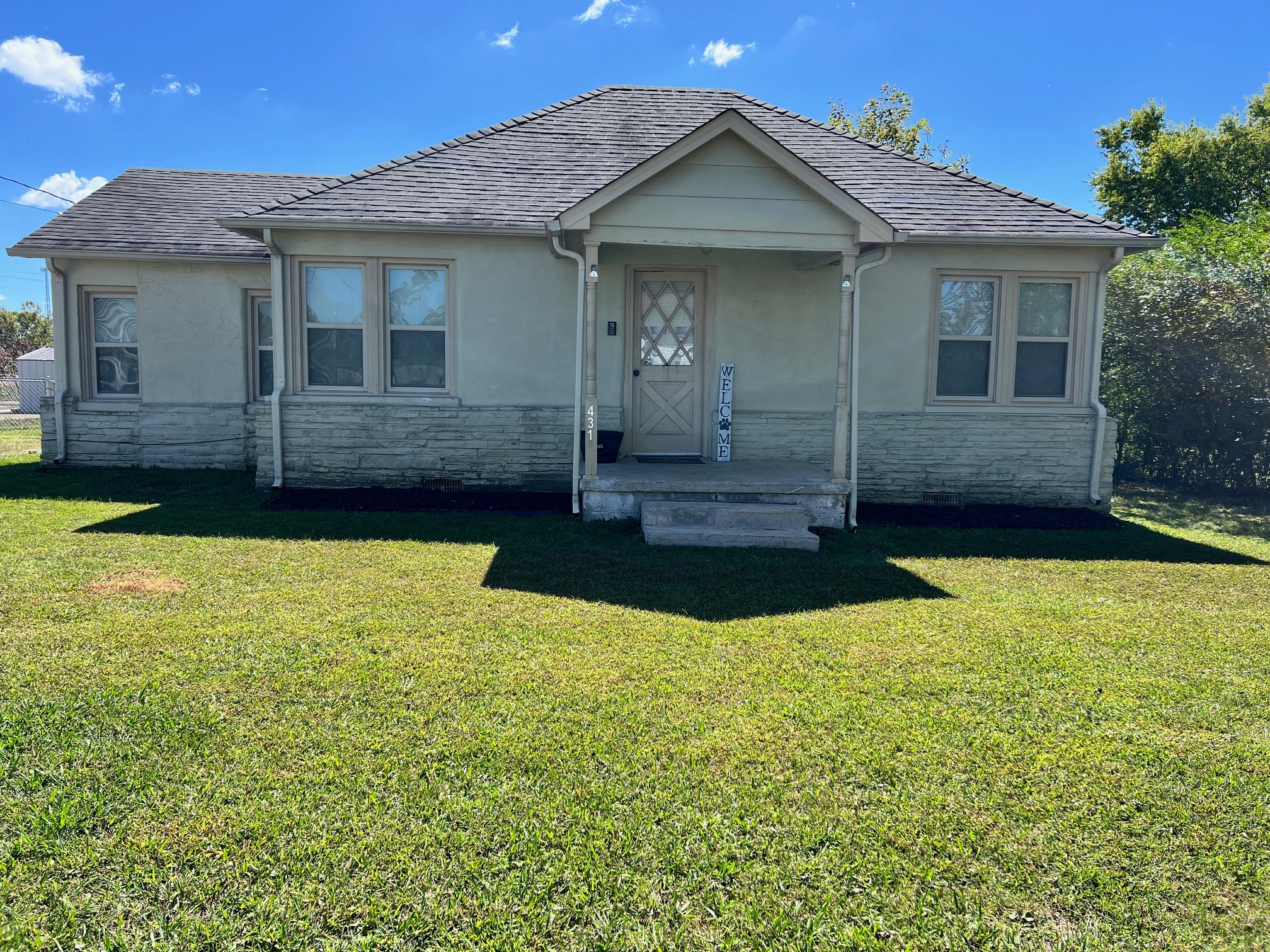 431 Elm Street Baxter, TN 38544 - Photo 2 of 22 a front view of a house with a yard