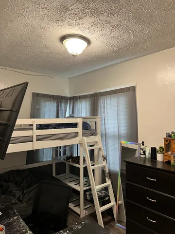 a view of a room with wooden cabinets
