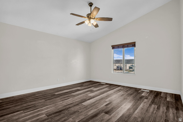 1836 West 800 North Mapleton, UT 84663 - Photo 14 of 38 Empty room featuring lofted ceiling, dark wood-style flooring, and ceiling fan