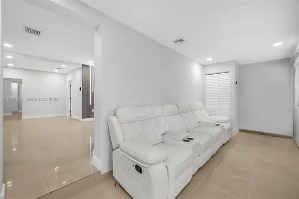 a living room with furniture and a couch