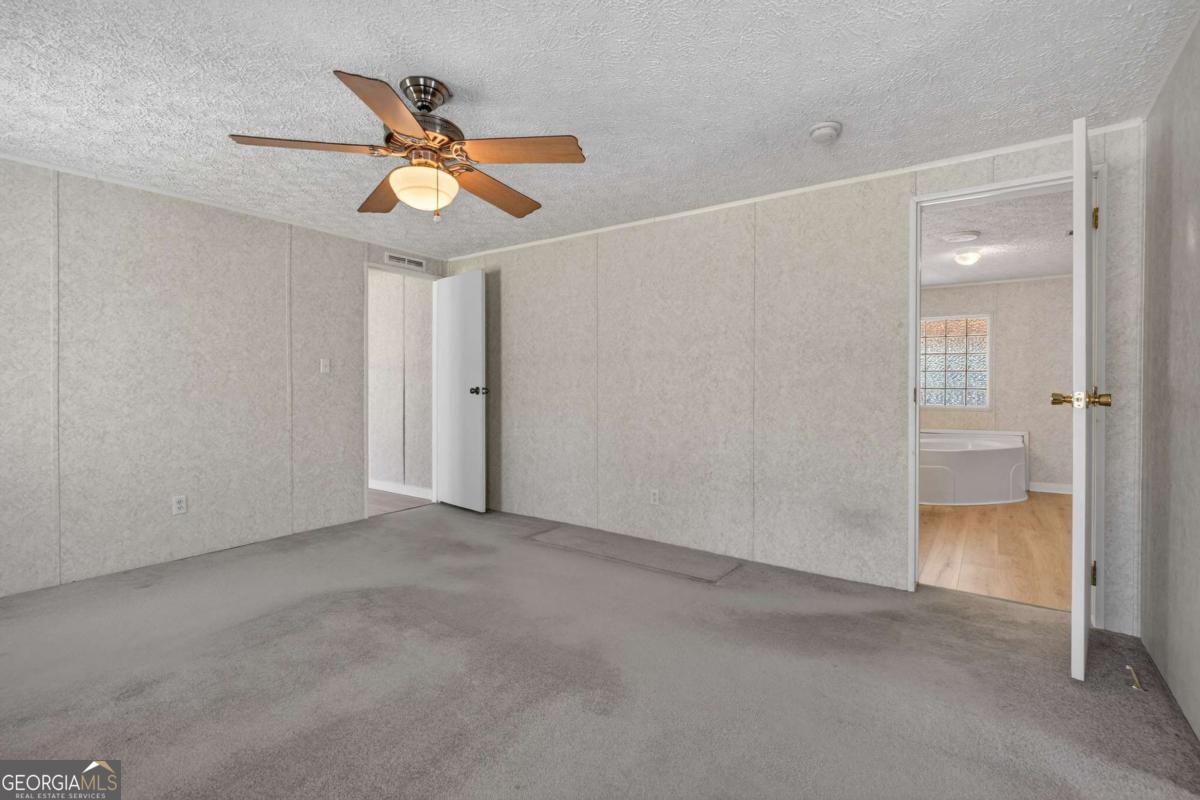 4156 Smiley Road Ludowici, GA 31316 - Photo 11 of 32 an empty room with closet and entryway