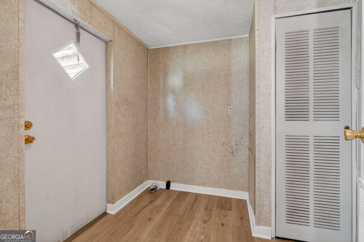 4156 Smiley Road Ludowici, GA 31316 - Photo 21 of 32 a view of a room with wooden floor and a window