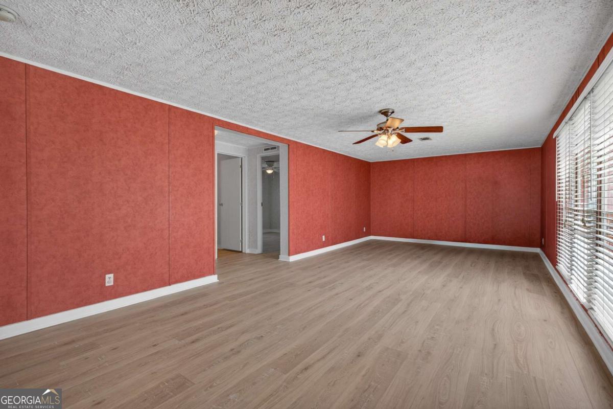4156 Smiley Road Ludowici, GA 31316 - Photo 23 of 32 a view of a livingroom with wooden floor and window