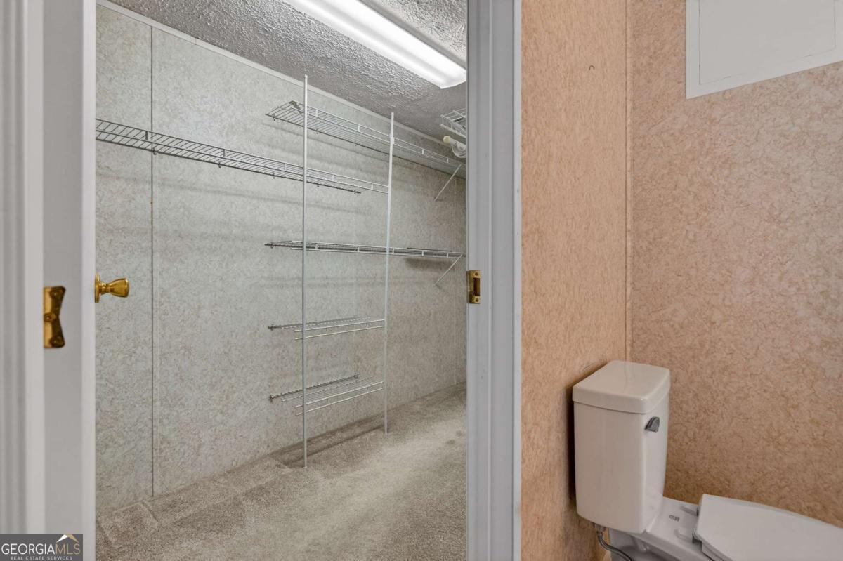 4156 Smiley Road Ludowici, GA 31316 - Photo 6 of 32 a bathroom with a shower and toilet