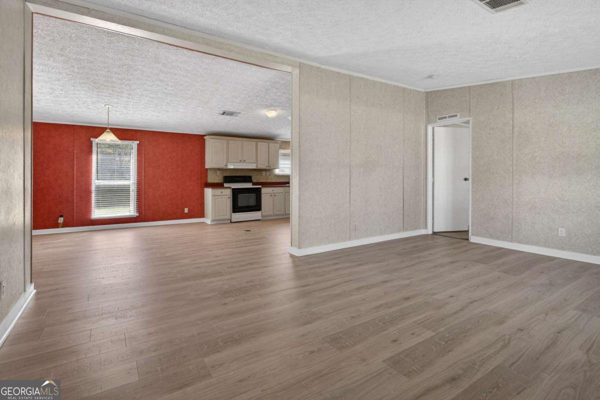 4156 Smiley Road Ludowici, GA 31316 - Photo 8 of 32 a view of a kitchen with a sink and a stove