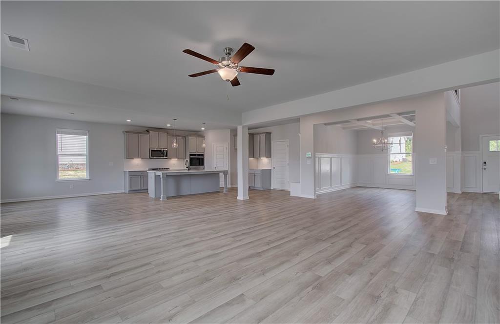 108 Felicity Pike Locust Grove, GA 30248 - Photo 12 of 37 a view of empty room with wooden floor and window