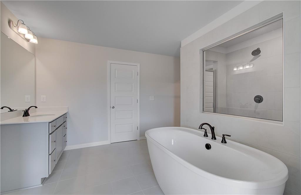 108 Felicity Pike Locust Grove, GA 30248 - Photo 28 of 37 a bathroom with a sink and mirror