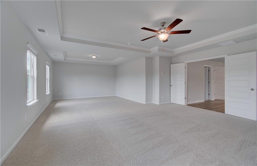 108 Felicity Pike Locust Grove, GA 30248 - Photo 31 of 37 a view of a livingroom with a ceiling fan and window