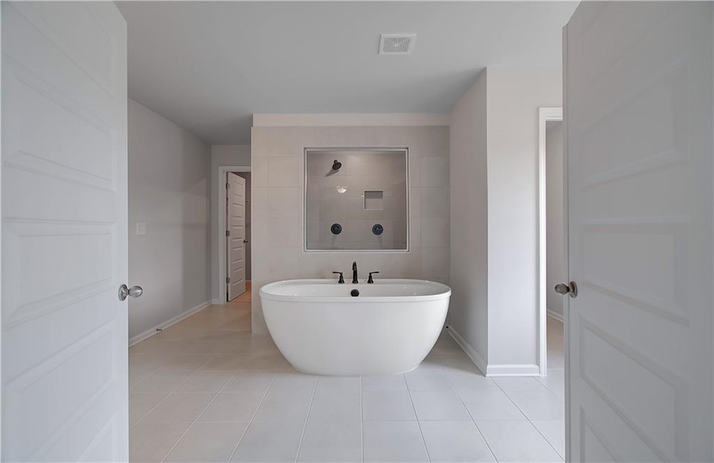 108 Felicity Pike Locust Grove, GA 30248 - Photo 32 of 37 a bathroom with a sink and a mirror