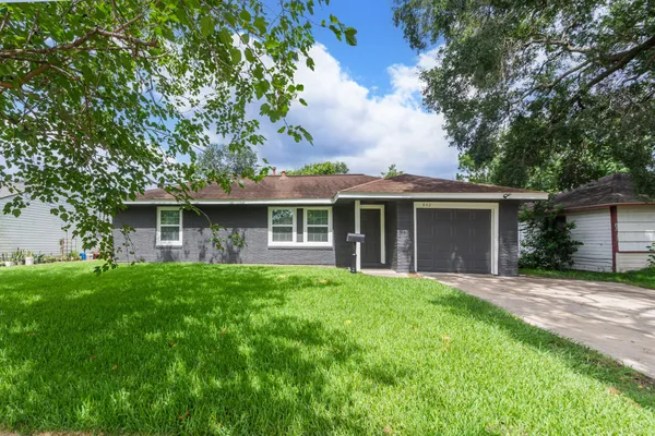 front view of a house with a yard