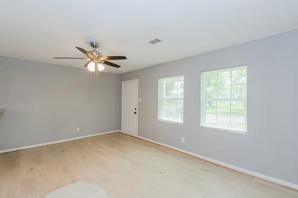 a view of an empty room with a window