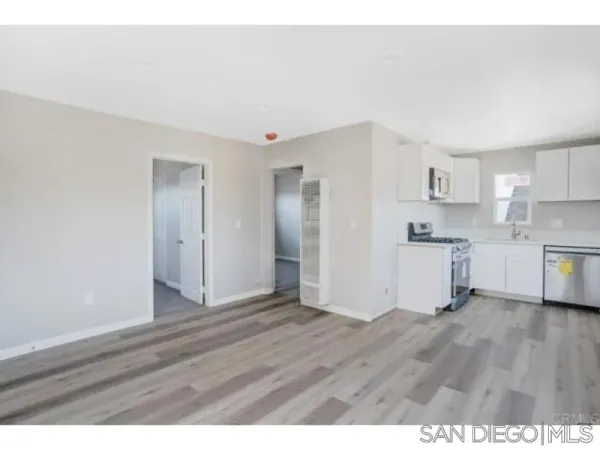 a view of kitchen with wooden floor