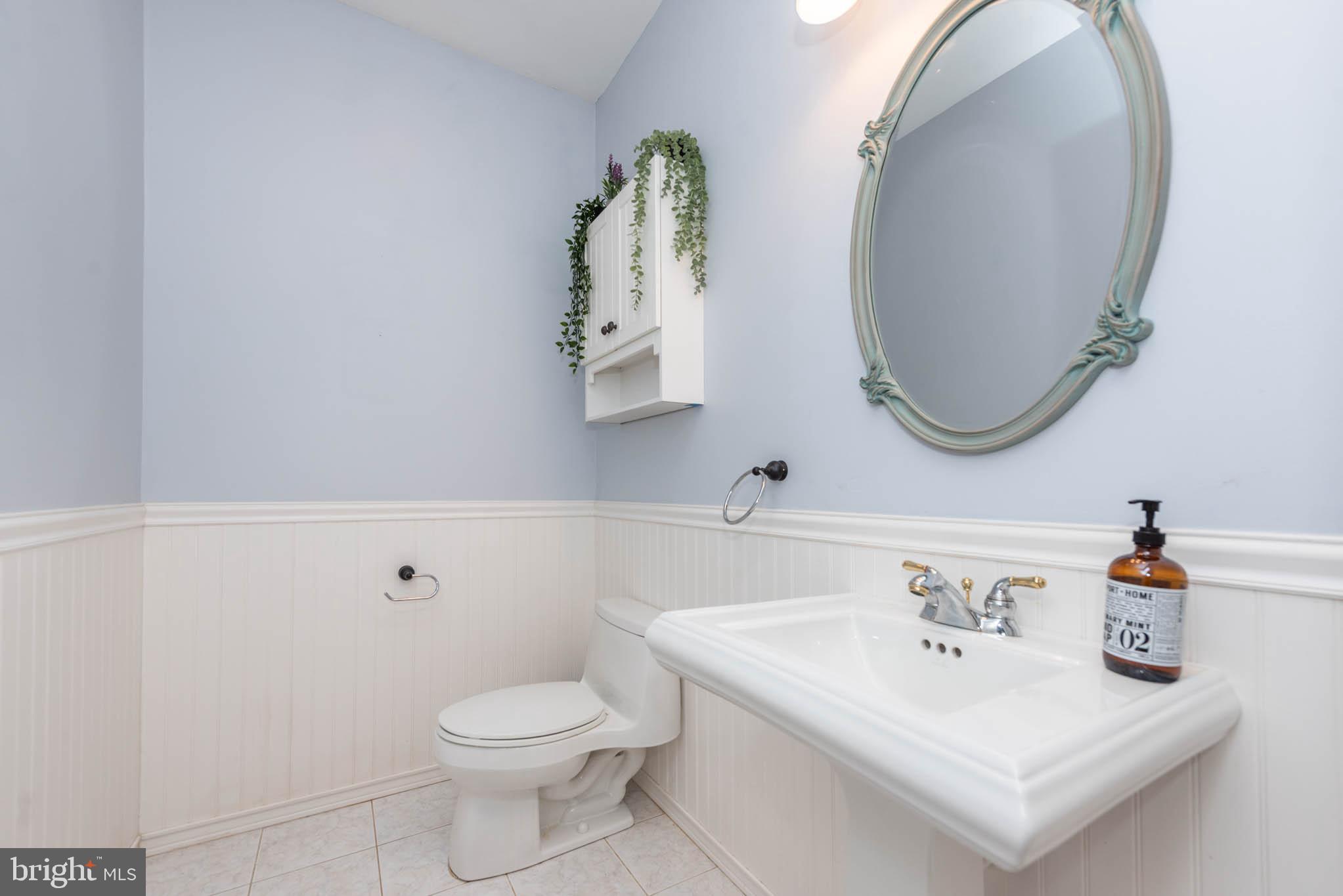 2623 Urey Road White Hall, MD 21161 - Photo 12 of 60 a bathroom with a sink toilet and mirror