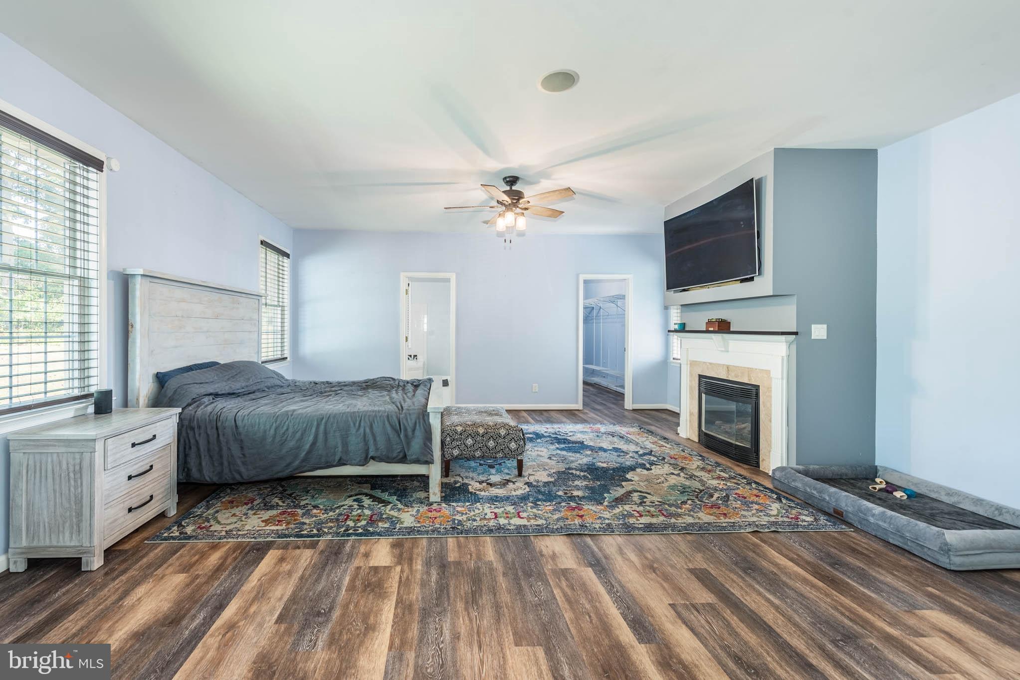 2623 Urey Road White Hall, MD 21161 - Photo 14 of 60 a bedroom with furniture fireplace and window