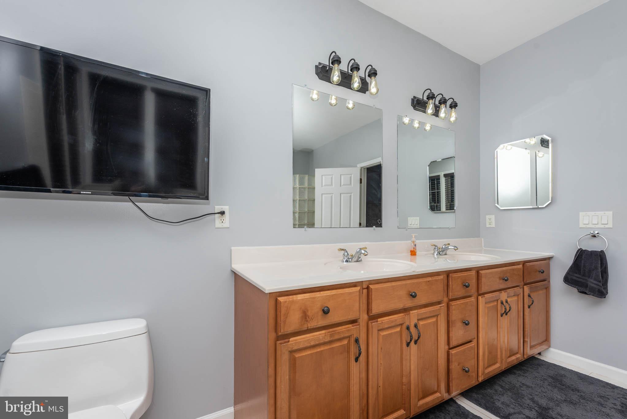2623 Urey Road White Hall, MD 21161 - Photo 21 of 60 a bathroom with a sink vanity and mirror