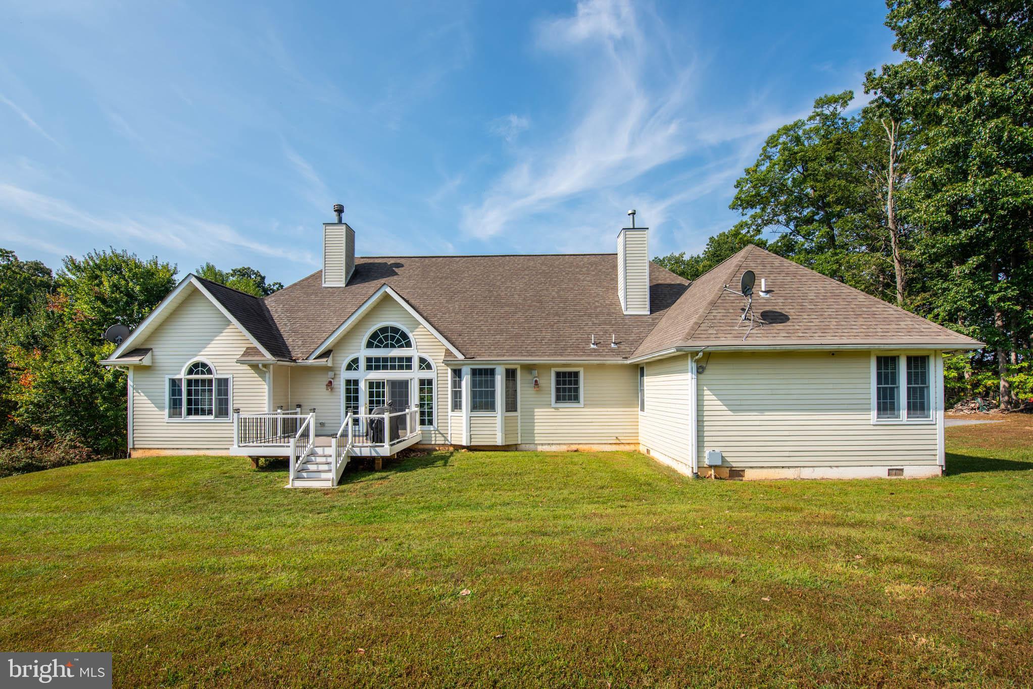 2623 Urey Road White Hall, MD 21161 - Photo 36 of 60 a front view of a house with a garden and trees