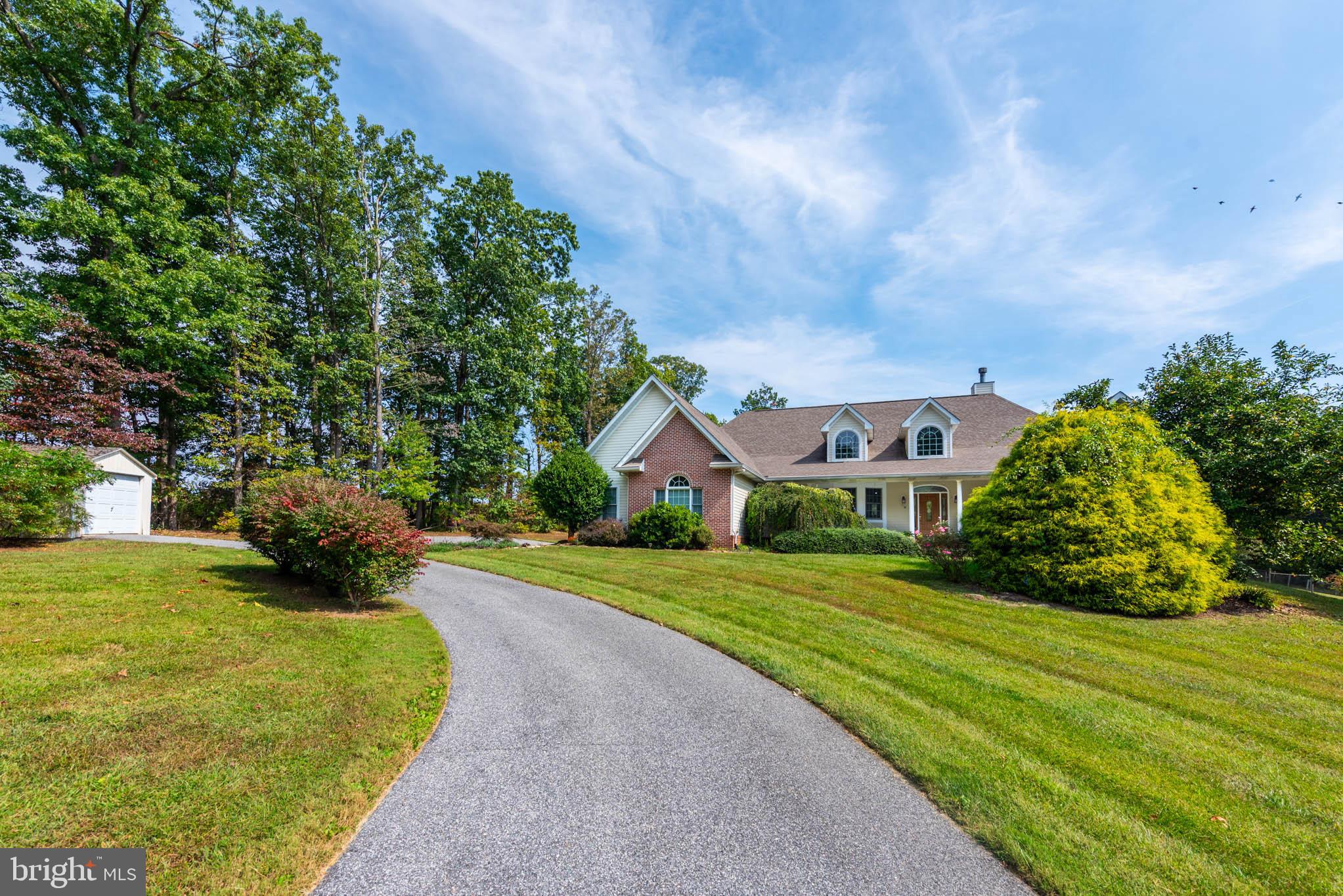 2623 Urey Road White Hall, MD 21161 - Photo 40 of 60 a view of a house with a big yard plants and large trees