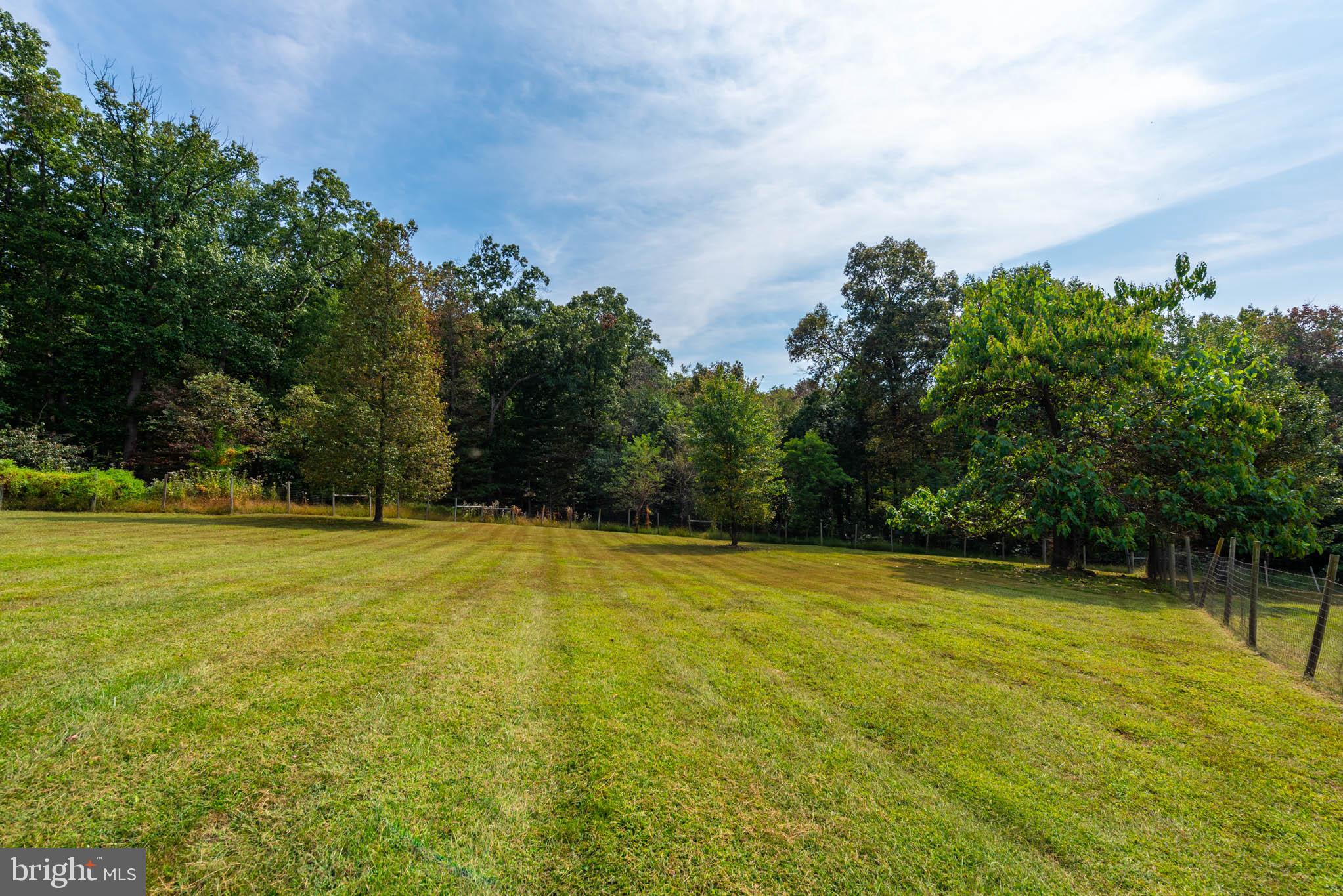 2623 Urey Road White Hall, MD 21161 - Photo 55 of 60 a view of a swimming pool with an outdoor space and seating area