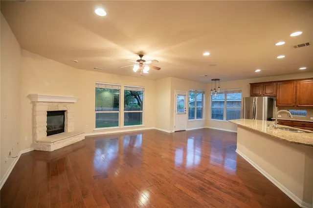 a view of a kitchen with a sink and a fireplace