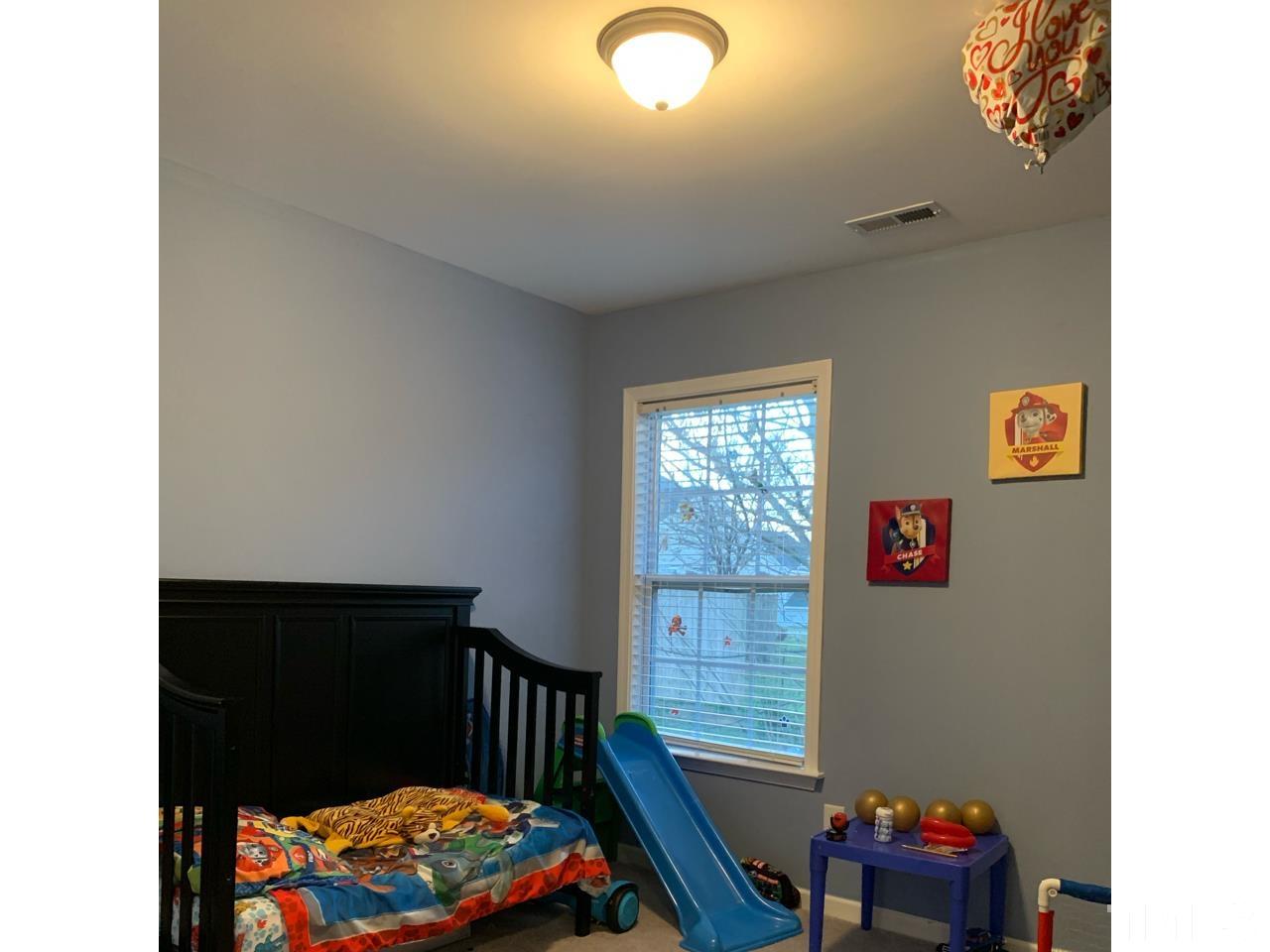 1422 Infinity Lane Raleigh, NC 27610 - Photo 11 of 16 a living room with furniture and a window