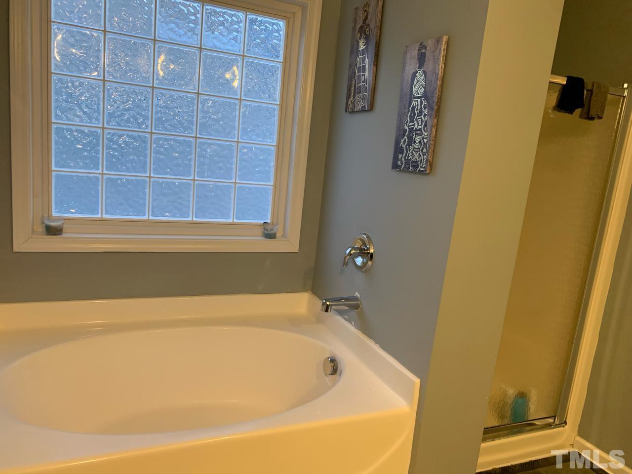 1422 Infinity Lane Raleigh, NC 27610 - Photo 16 of 16 a bathroom with a bathtub