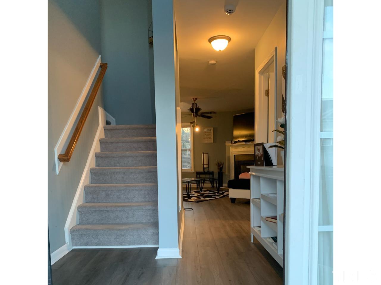 1422 Infinity Lane Raleigh, NC 27610 - Photo 2 of 16 a view of a living room with furniture and a view of a bathroom