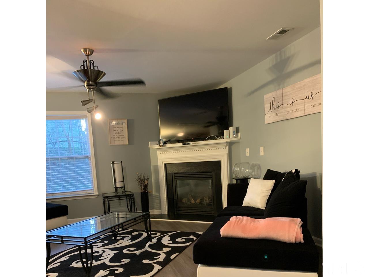 1422 Infinity Lane Raleigh, NC 27610 - Photo 5 of 16 a living room with furniture and a fireplace