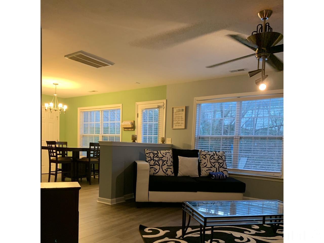 1422 Infinity Lane Raleigh, NC 27610 - Photo 6 of 16 a living room with furniture and wooden floor