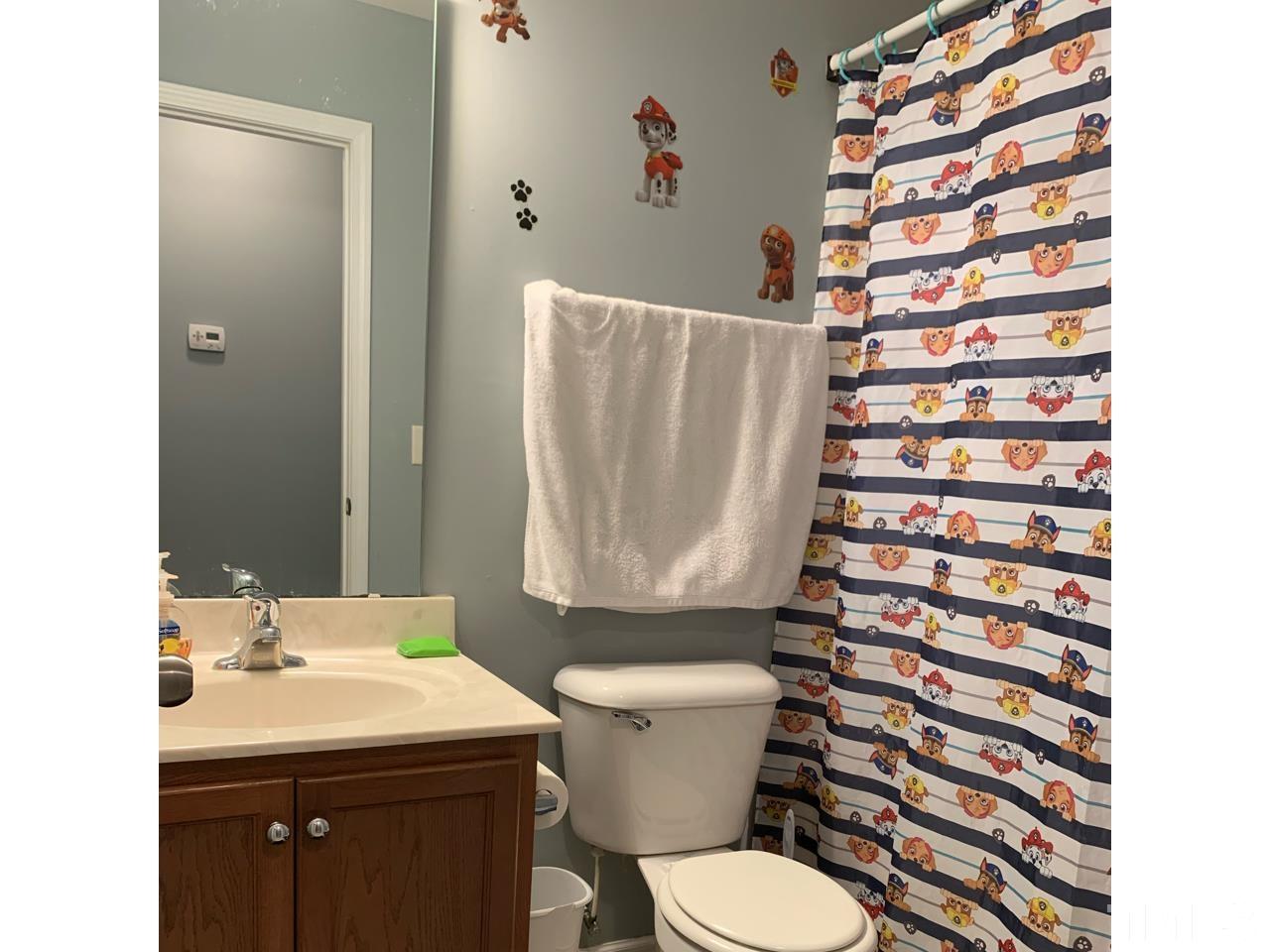 1422 Infinity Lane Raleigh, NC 27610 - Photo 9 of 16 a bathroom with a sink toilet and shower