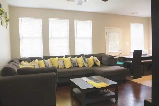 a living room with furniture and a large window